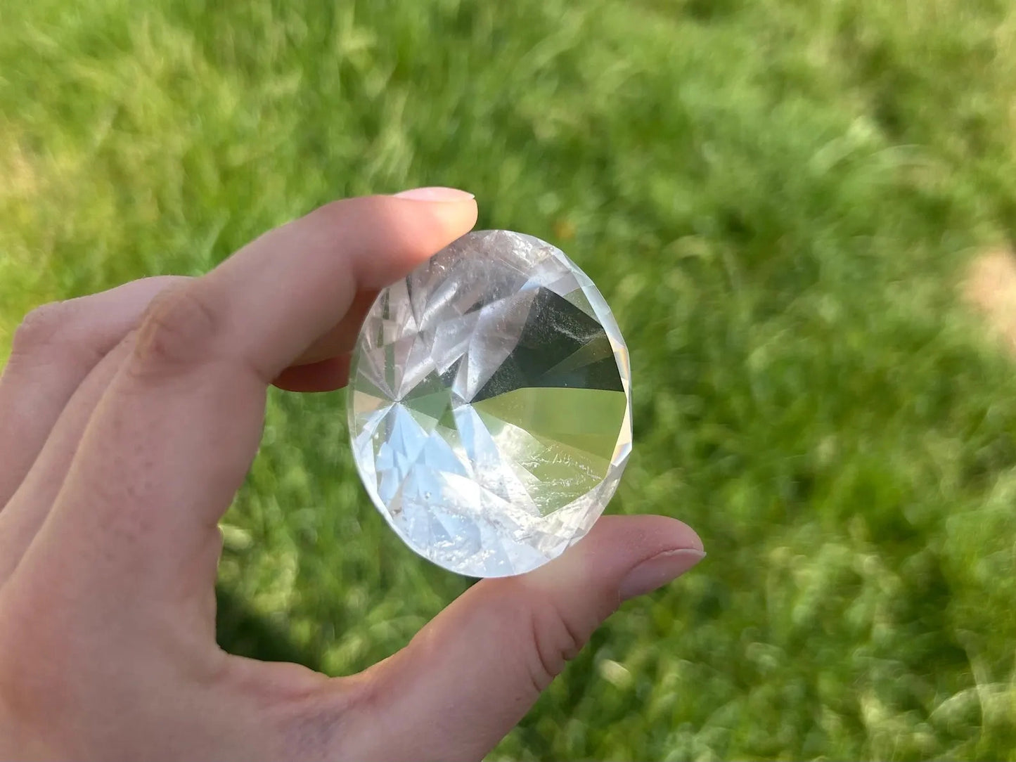 400 carat flawless brazilian clear quartz brilliant cut faceted gemstone, highlighting its intricate cut - clearquartzshop