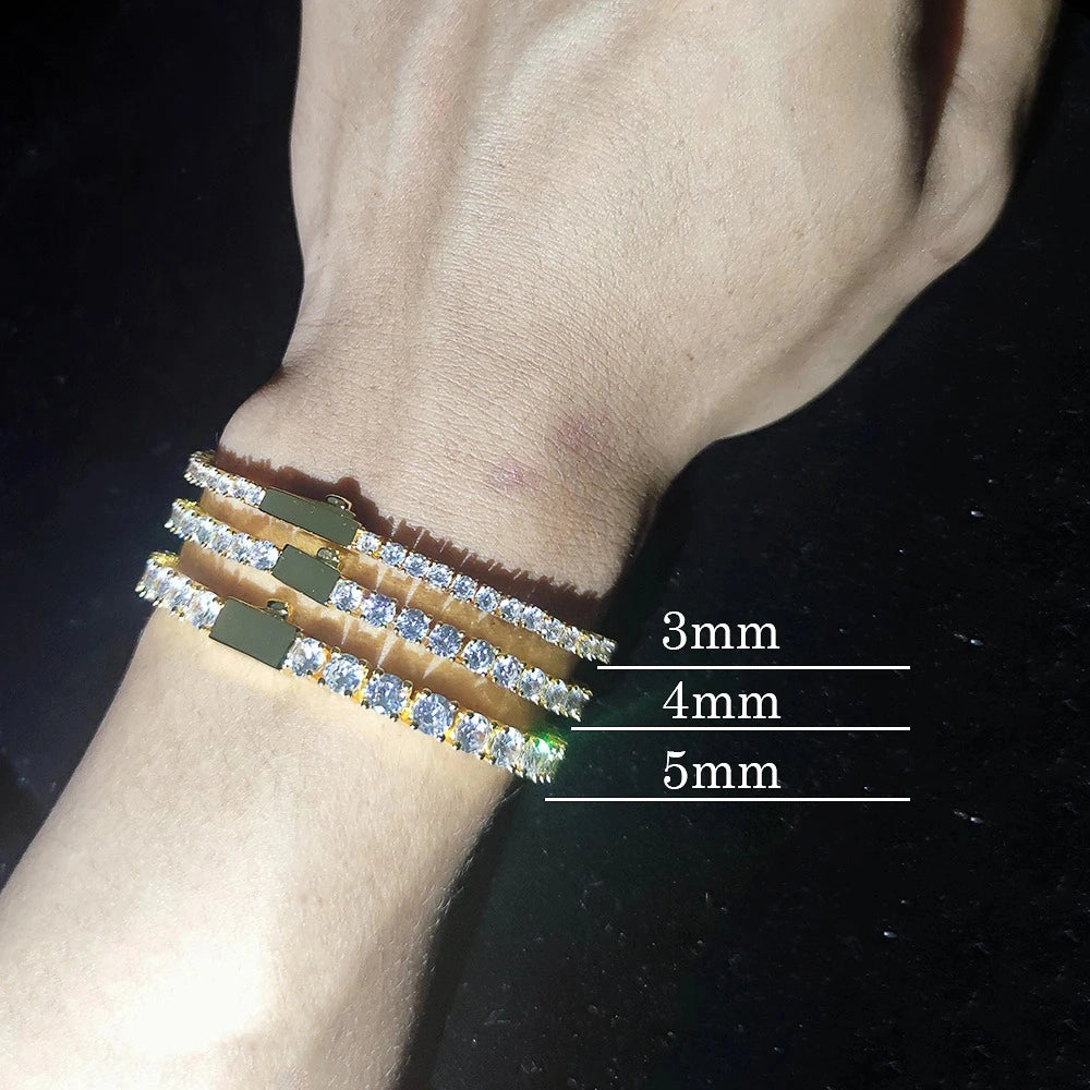 3mm, 4mm, and 5mm iced out tennis bracelets stacked on wrist showcasing size comparison - clearquartzshop