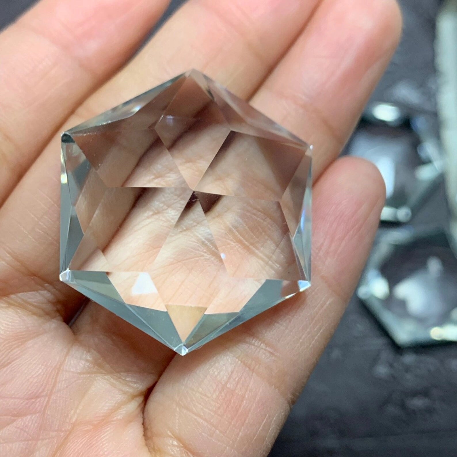top-down view of the 125 carat flawless brazilian clear quartz faceted gemstone - clearquartzshop