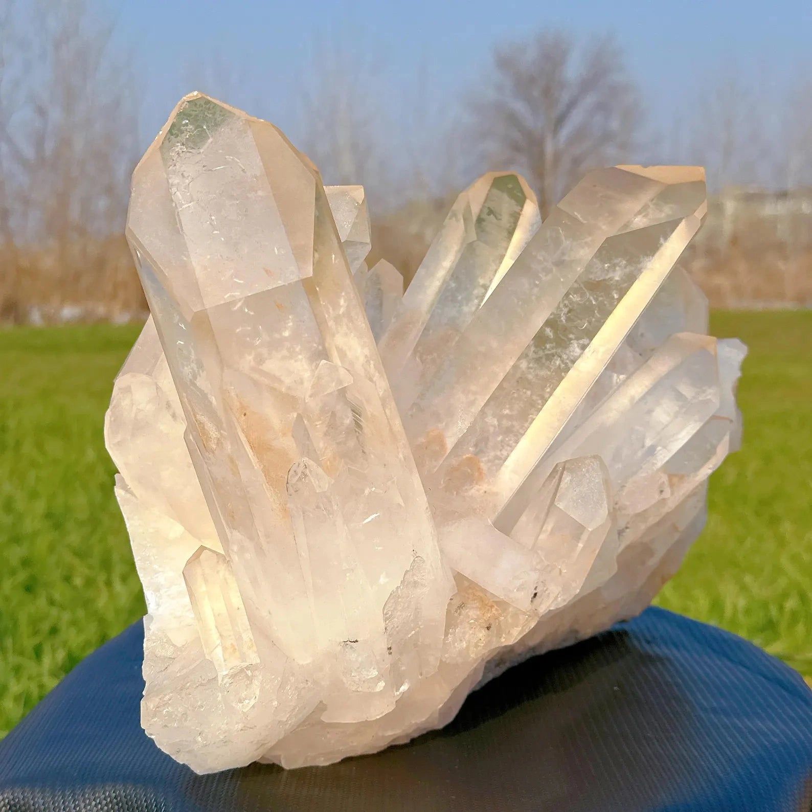 angled display of large 15kg natural quartz cluster from brazil - clearquartzshop