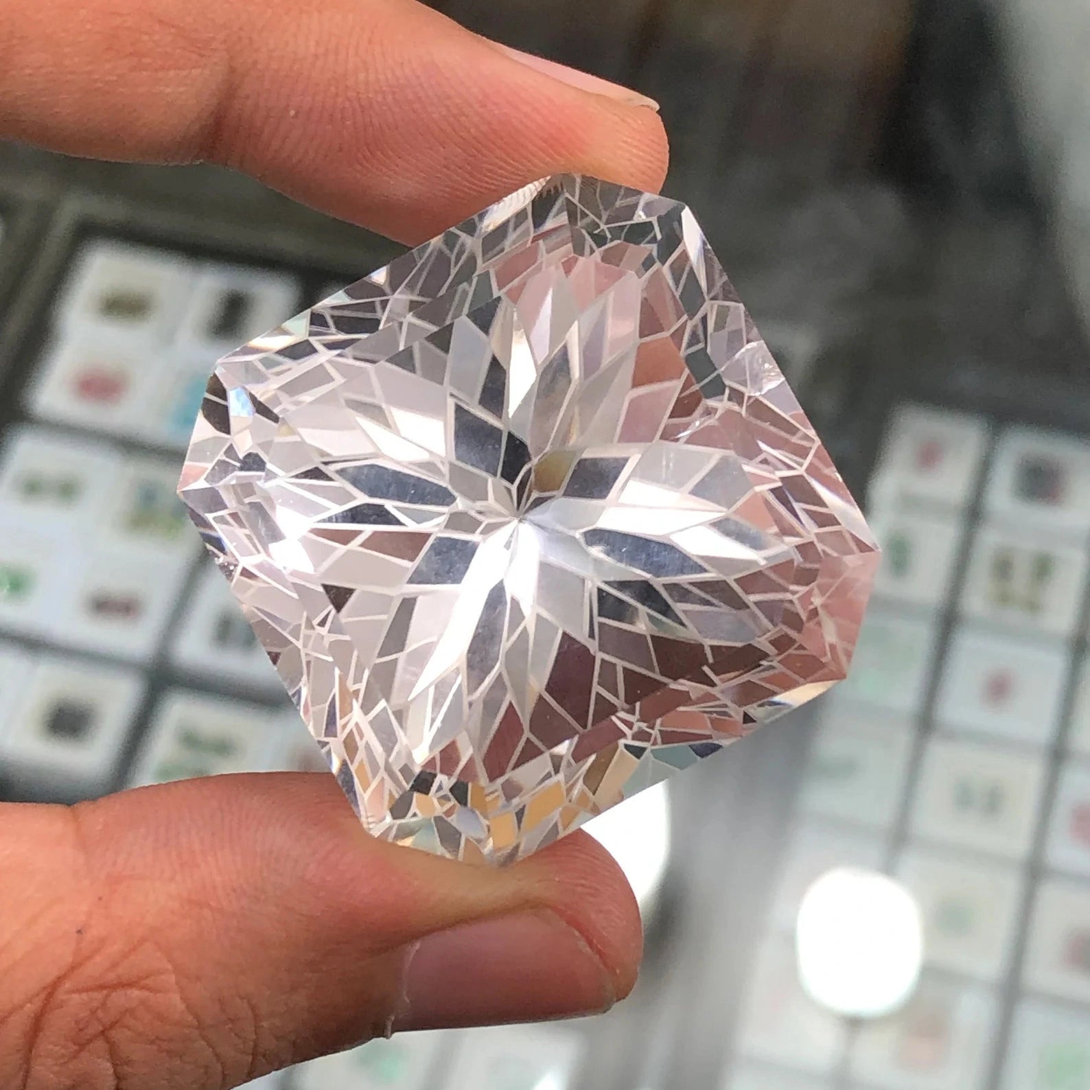 185 carat flawless pakistani clear quartz flower faceted gemstone, showcasing its intricate floral cut - clearquartzshop