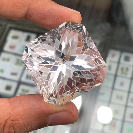 185 carat flawless pakistani clear quartz flower faceted gemstone, showcasing its intricate floral cut - clearquartzshop
