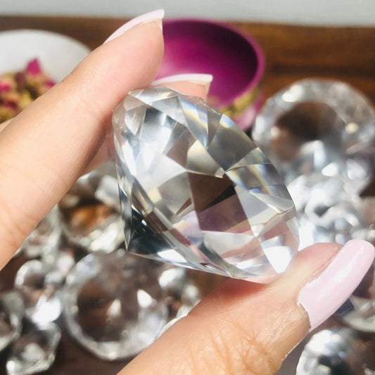350 carat flawless brazilian clear quartz faceted gemstone held in hand, showcasing its brilliant sparkle - clearquartzshop