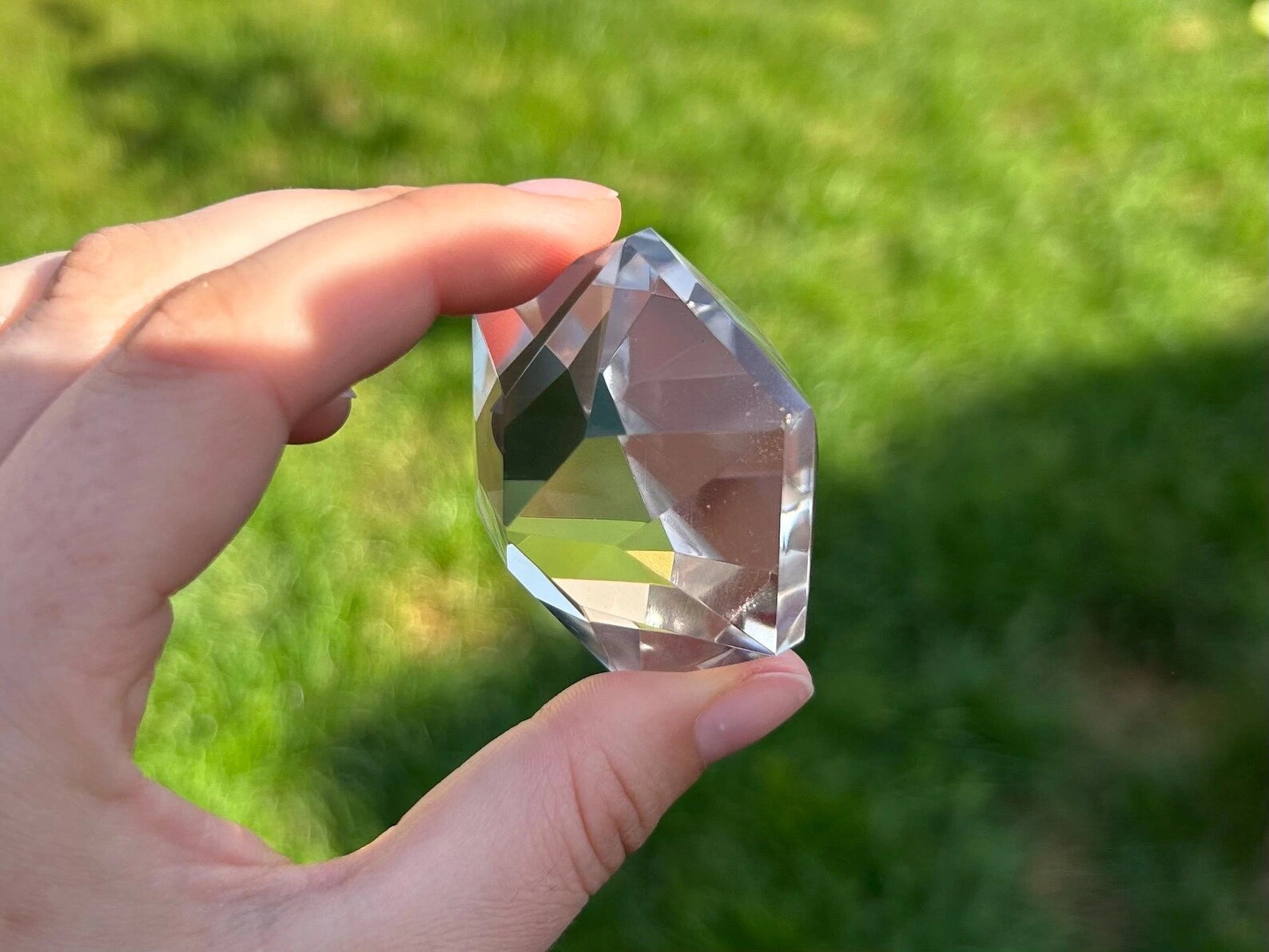375 carat flawless brazilian clear quartz multi-faceted gemstone, showing its pristine transparency - clearquartzshop