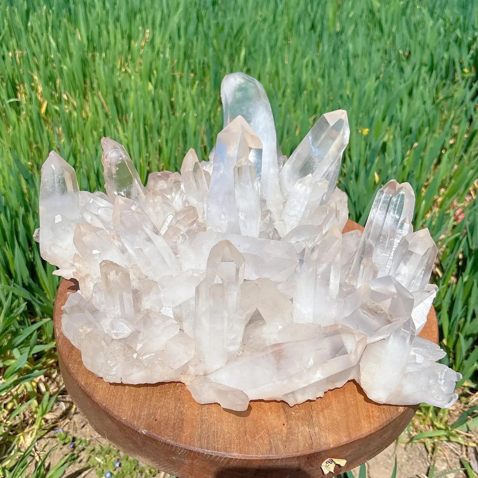 9kg museum-grade brazilian clear quartz cluster on wood stand, side angle view - clearquartzshop
