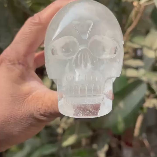 360-degree video of 1kg himalayan quartz skull outdoors in hand - clearquartzshop