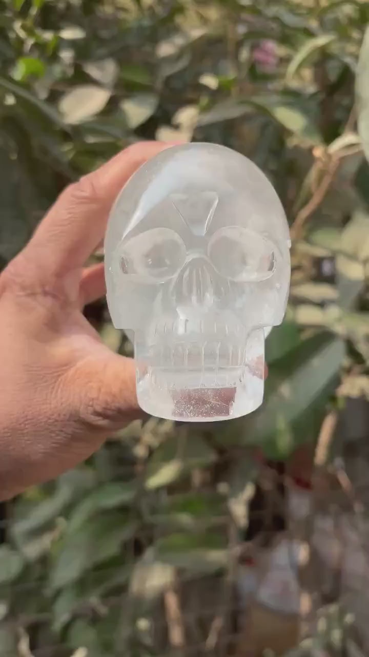 360-degree video of 1kg himalayan quartz skull outdoors in hand - clearquartzshop