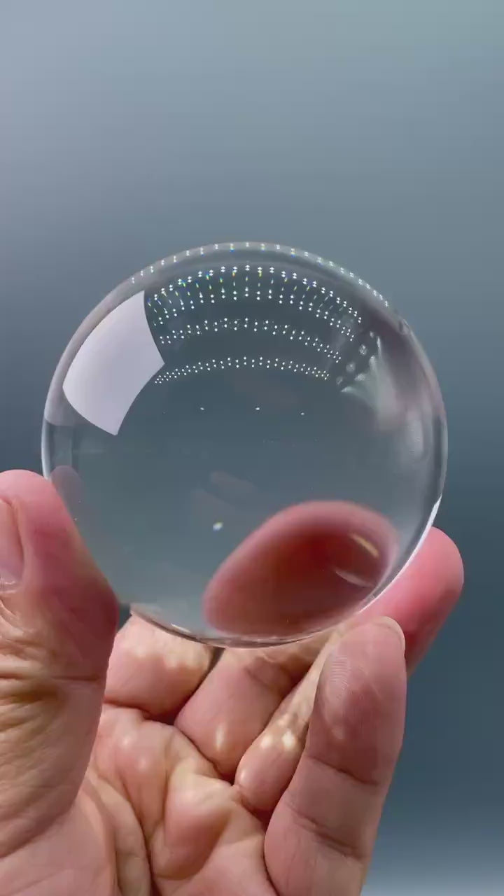 3000 carat flawless himalayan clear quartz sphere, highlighting its internal brilliance and perfect form - clearquartzshop